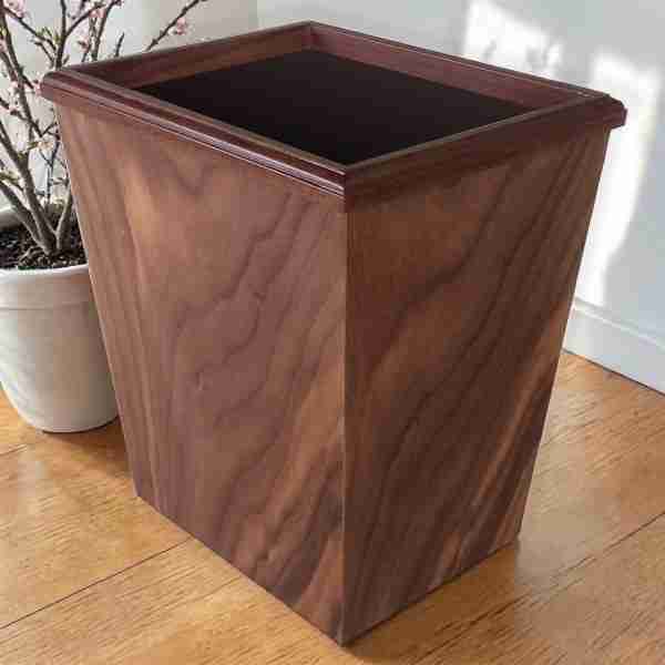 walnut swirl 13 quart wastebasket on wood floor