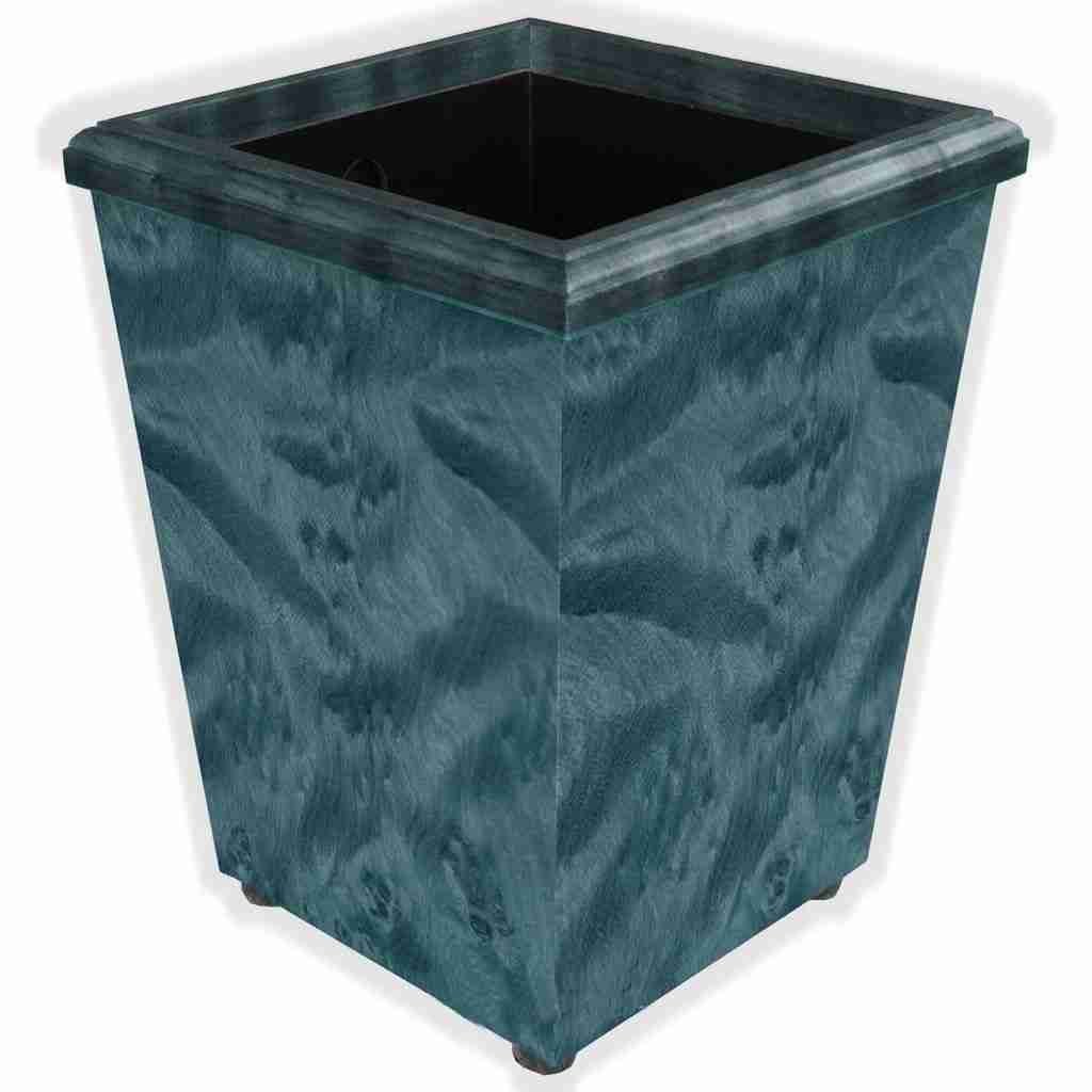 A small waste basket featuring byed blue birch veneer with a black PVC liner, designed for compact spaces.